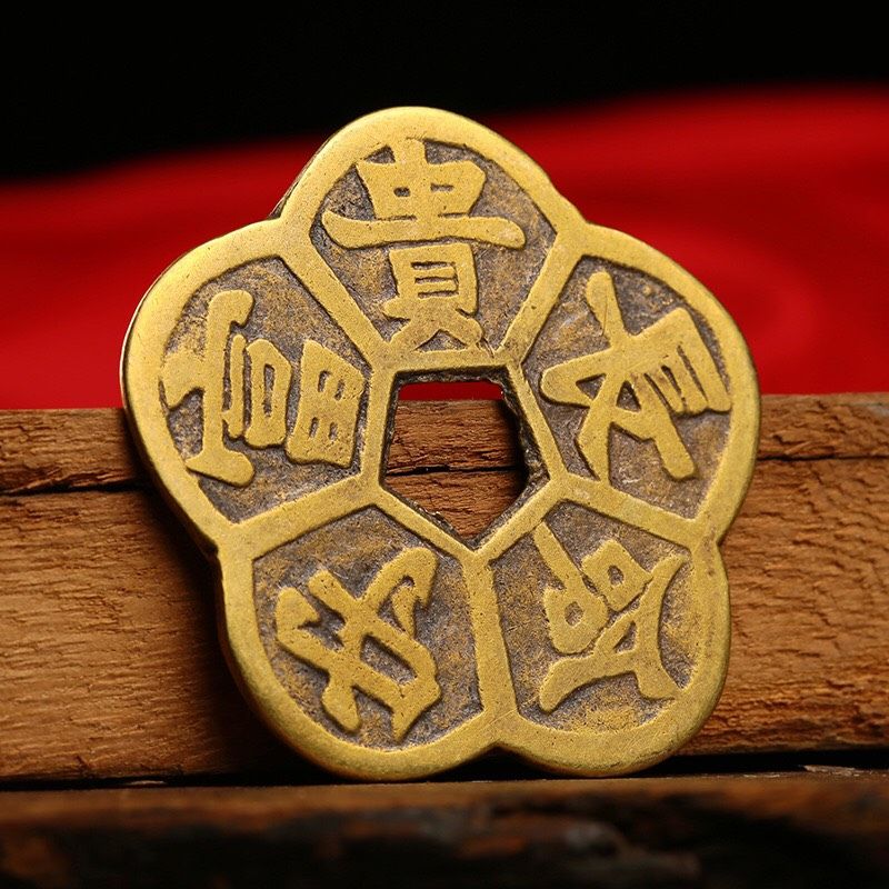 Đồng tiền hoa mai chiêu tài dong tien hoa mai